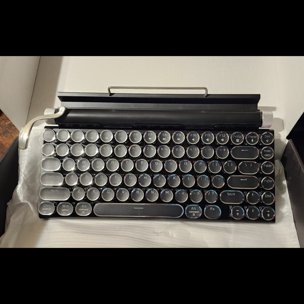 Black and Silver Retro Mechanical Keyboard with Device Holder